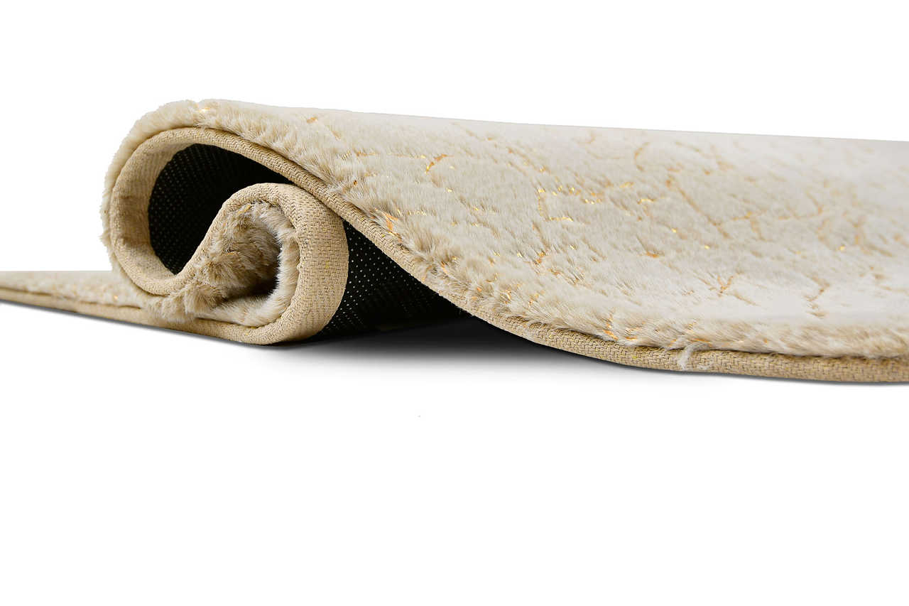 Close-up of Rabbit Tex rug texture in champagne and gold