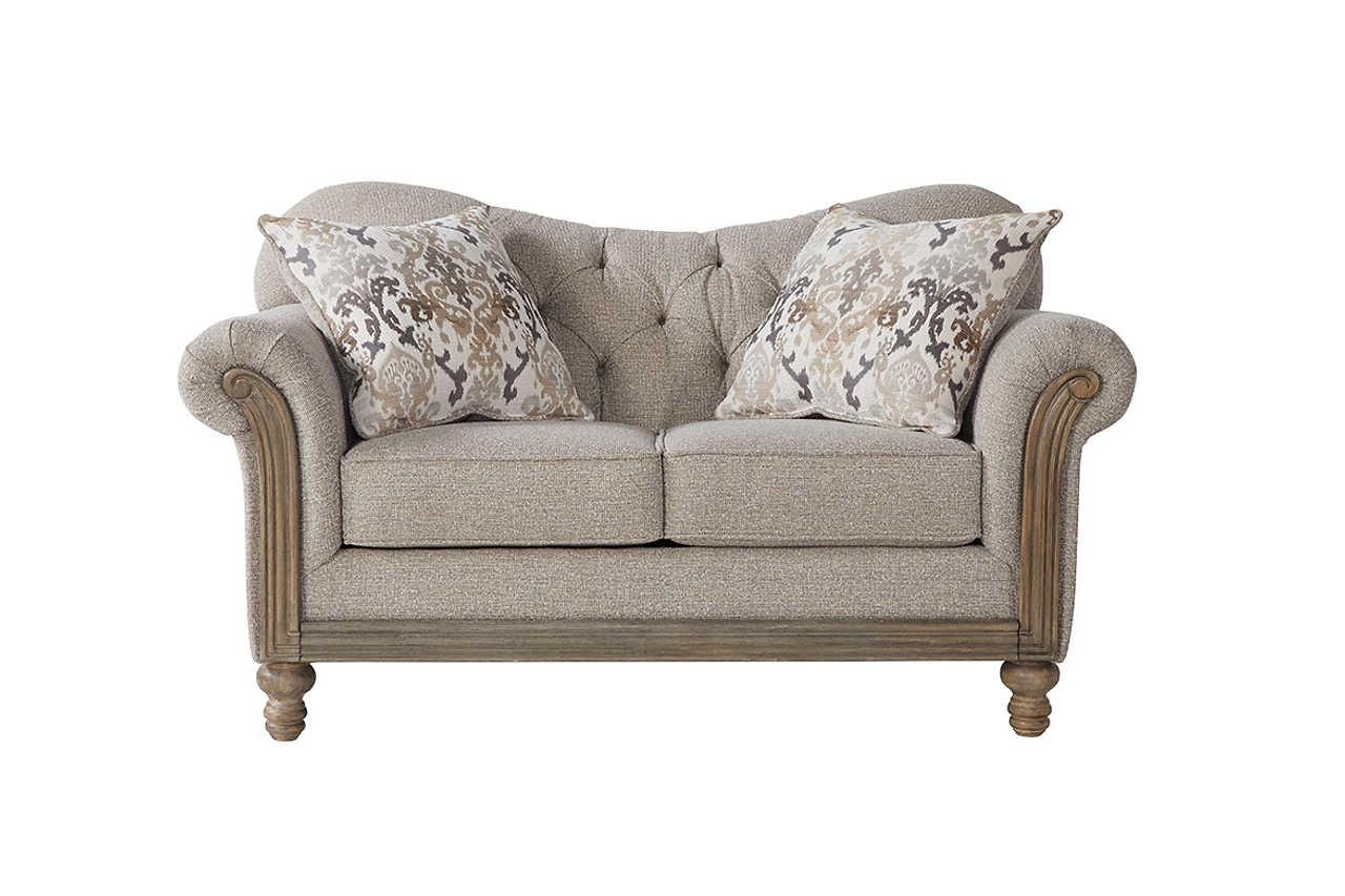Close-up of tufted fabric and wooden frame on chair