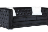 Close-up of tufted black velvet upholstery on Paris set