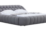 Overall view of Bubbles gray upholstered queen bed in room setting