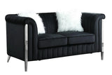 Close-up of velvet upholstery and silver leg detail on Fara set