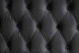 Side profile of black platform queen bed