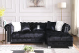 Close-up detail of black velvet tufted upholstery on Yaz sectional