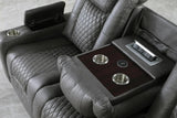 Side angle showing power reclining mechanism on loveseat
