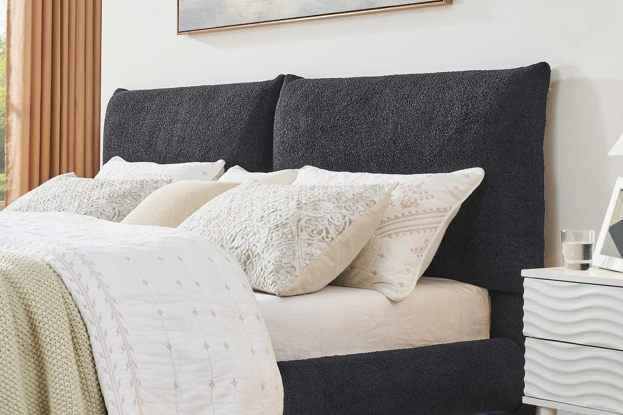 Front view of Zima grey upholstered queen platform bed with LED lights
