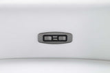 Close-up on power recliner control on white leather sectional