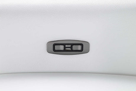 Close-up on power recliner control on white leather sectional