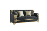 Close-up detail of Hira Black Living Room Set’s gold metal accent and black upholstery