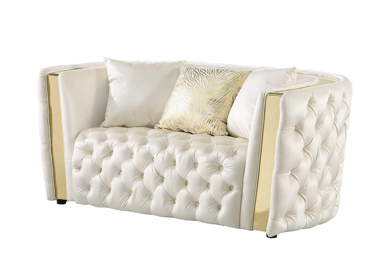 Close-up of tufted white upholstery and gold details on Roka chair