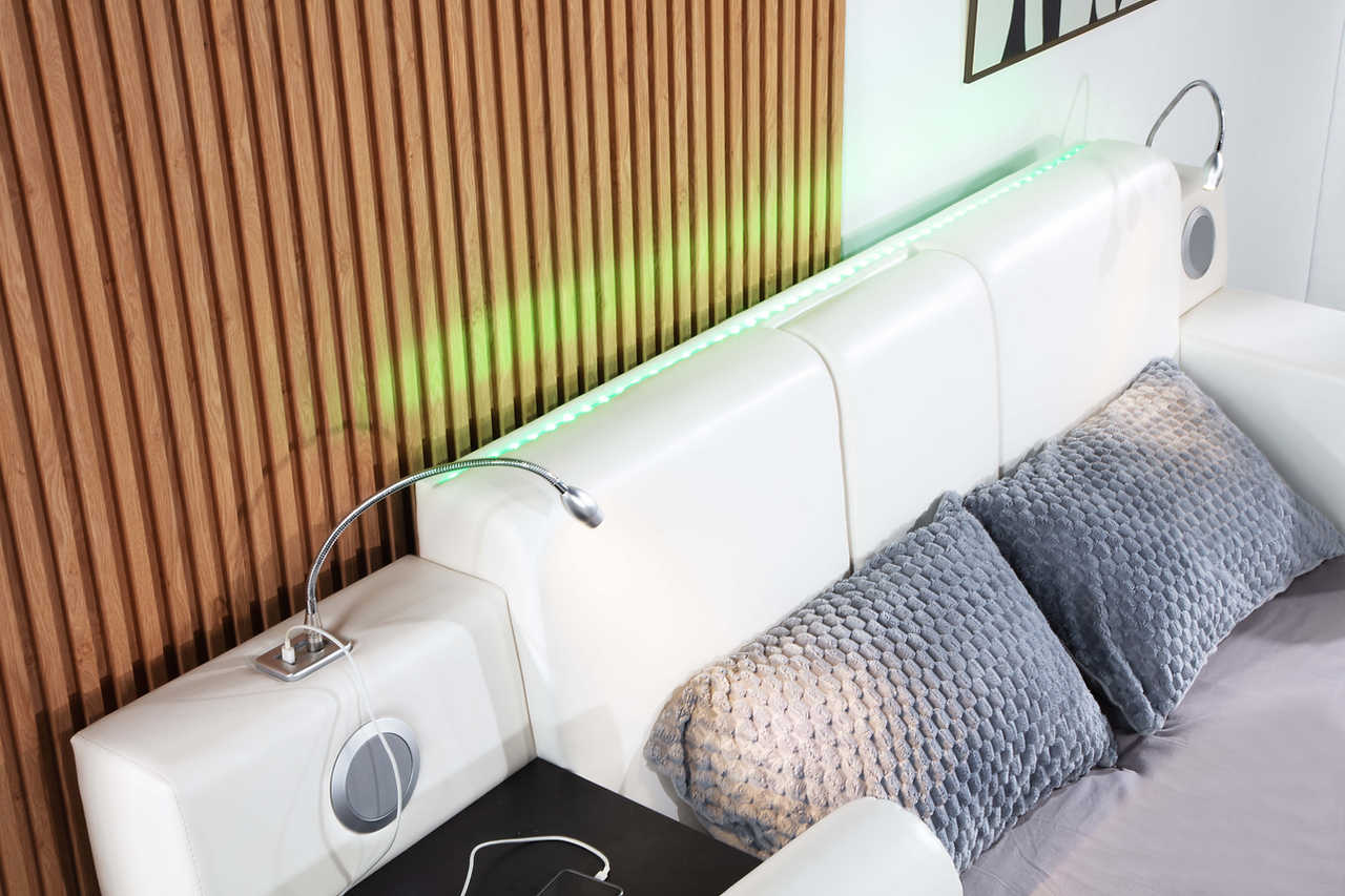 Close-up of Apollo bed LED reading lights and Bluetooth speakers