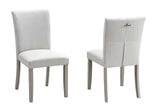 Detail view highlighting the grey fabric upholstery on the dining chairs