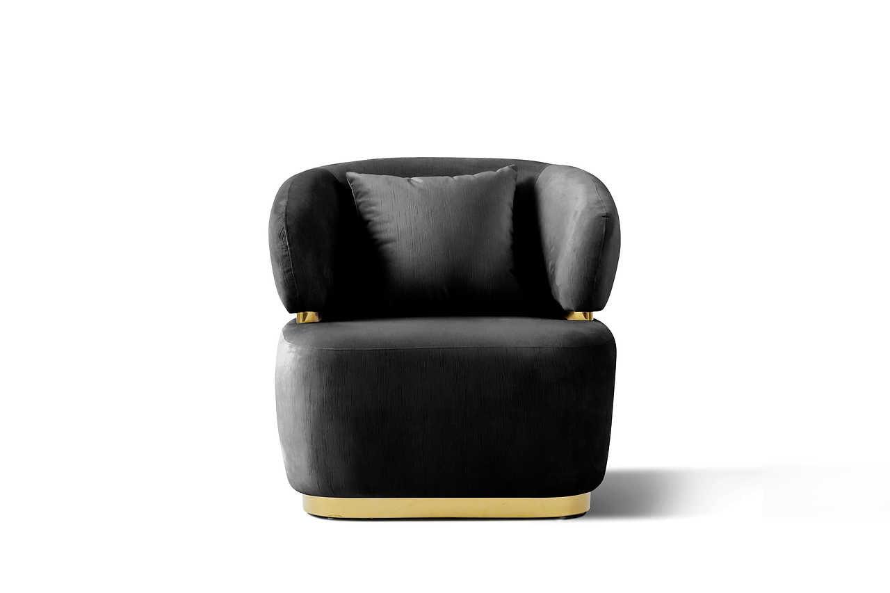 Close-up of sofa arm with gold metal accents