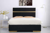 Close-up of velvet upholstery and gold detailing on Cartier Platform Queen Bed