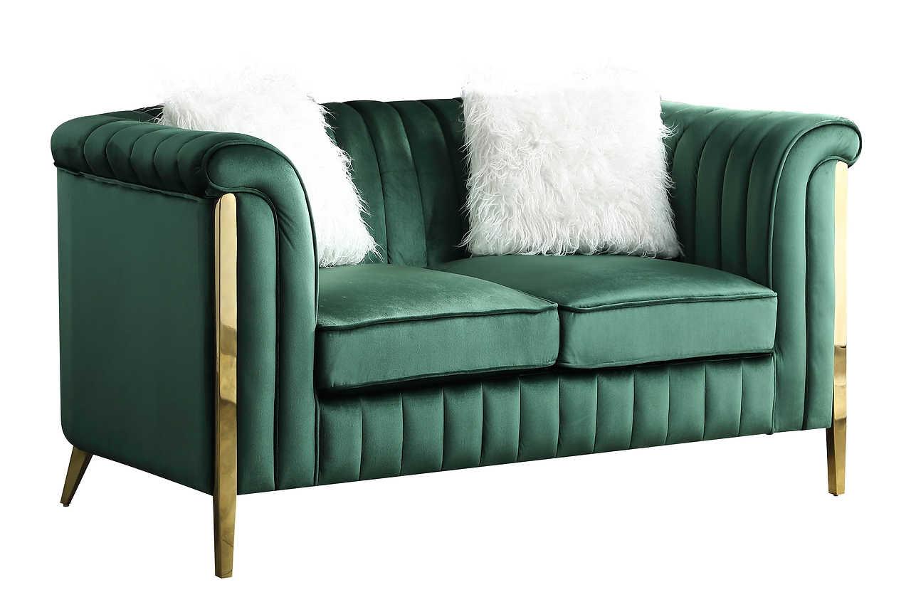 Close-up detail of emerald green velvet fabric and gold legs on Fara sofa