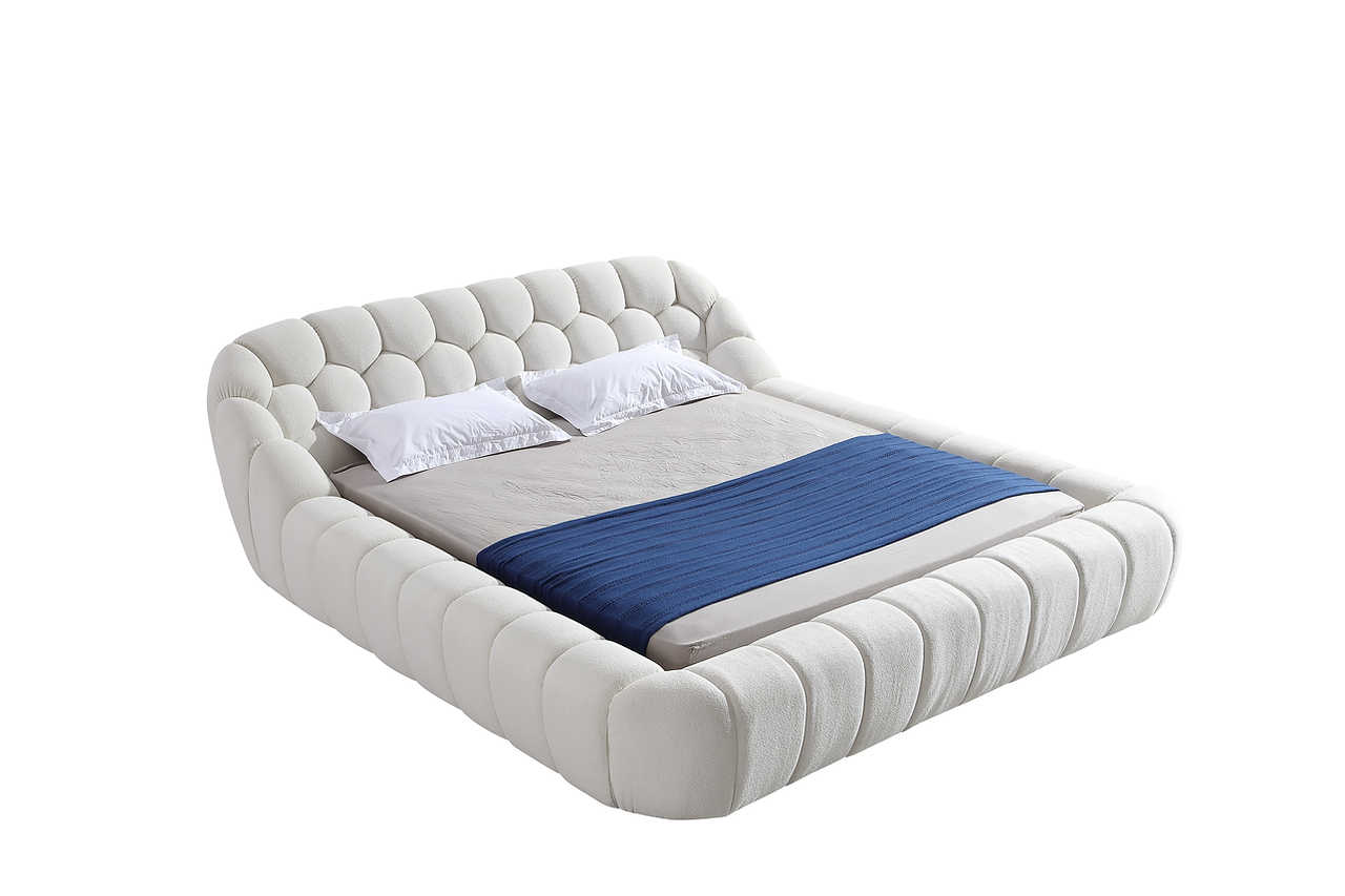 White upholstered platform bed full view in bedroom