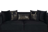 Close-up detail of Monaco Black Velvet upholstery and gold accents