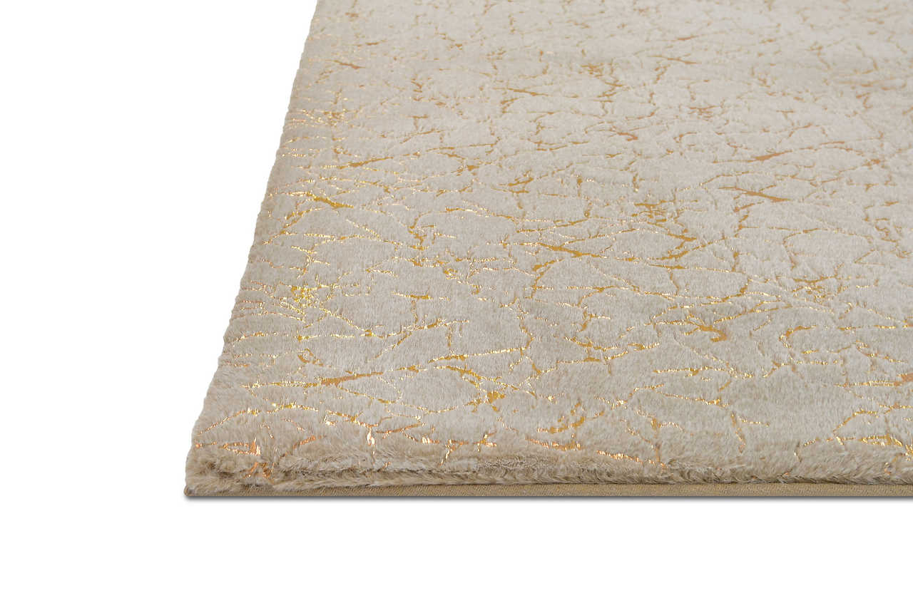 Decorative setting with Rabbit Tex champagne and gold rug on floor