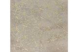 Rabbit Tex medium rug in champagne and gold, angled view