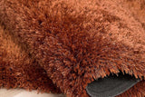 Close-up of Afro Shag Rust rug texture and color