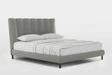Gray upholstered headboard close-up