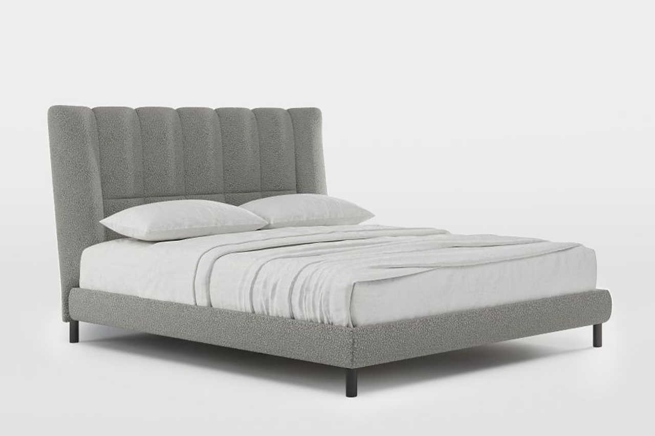 Gray upholstered headboard close-up