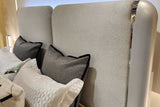 Side view of Amara pearl white nightstand with padded headboard detail