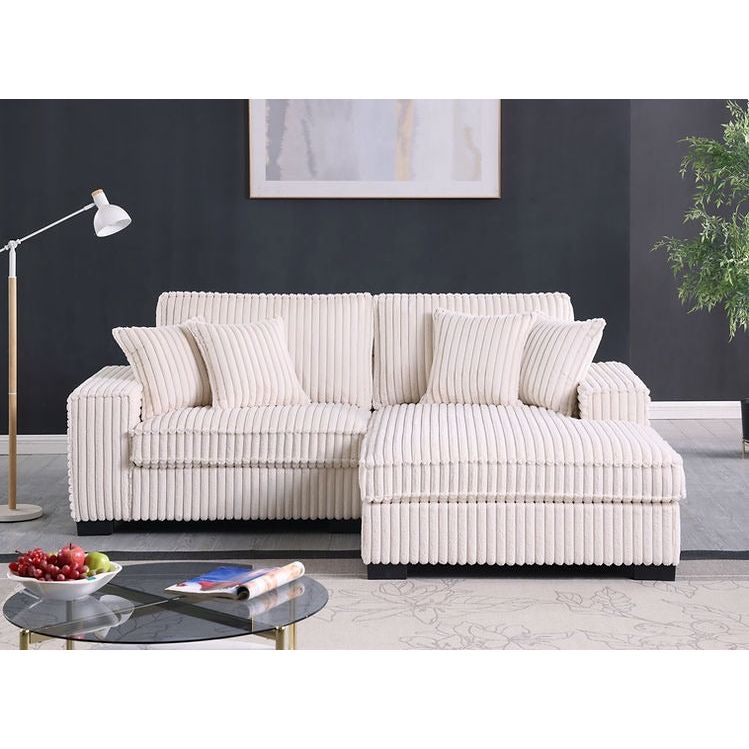Close-up detail of cream corduroy fabric on sectional sofa