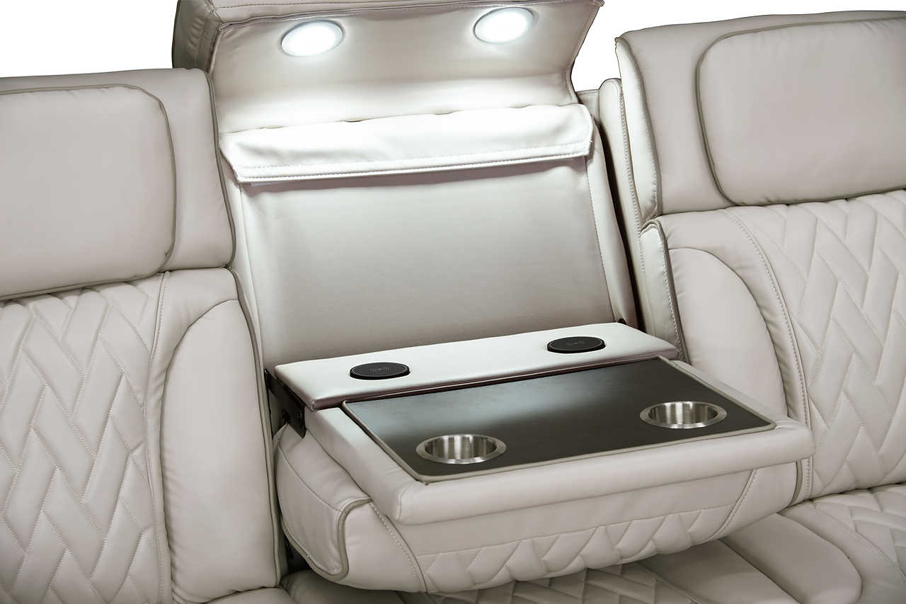 Detail of wireless charger and USB ports on sofa arm