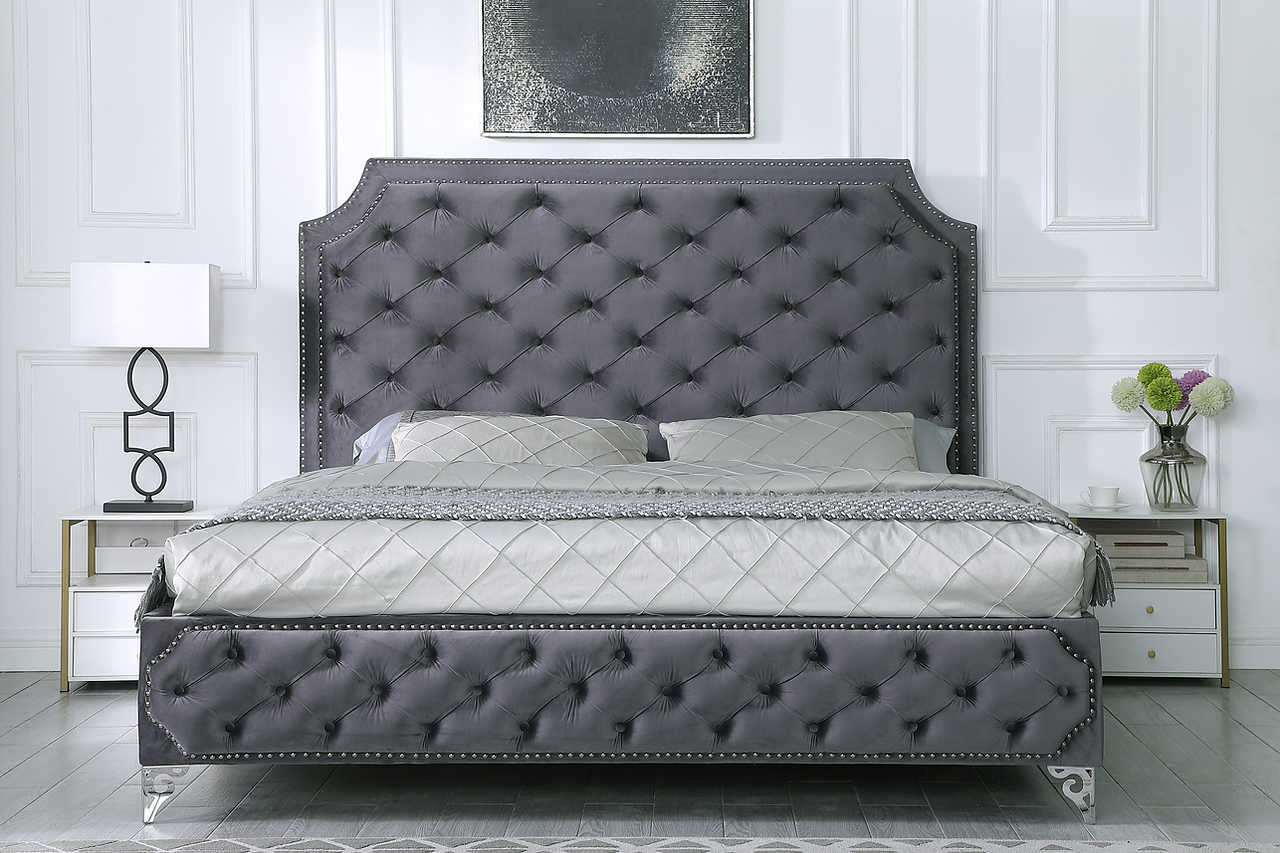 Leilah king bed with grey velvet tufted headboard angled view