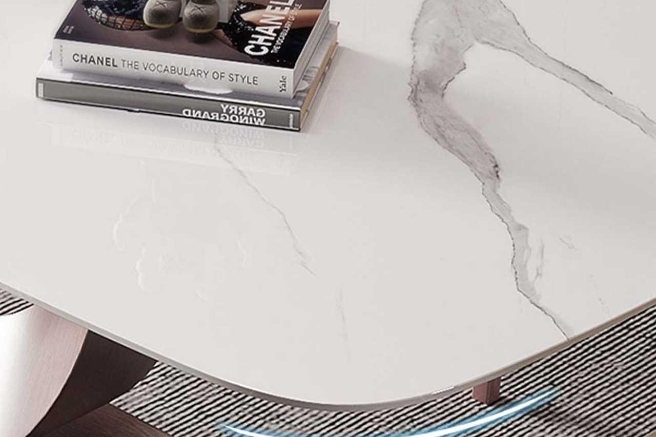 Side angle of dining table showing carbon steel legs
