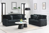 Close-up of fabric and stripe pillows on Tarra black fabric chair