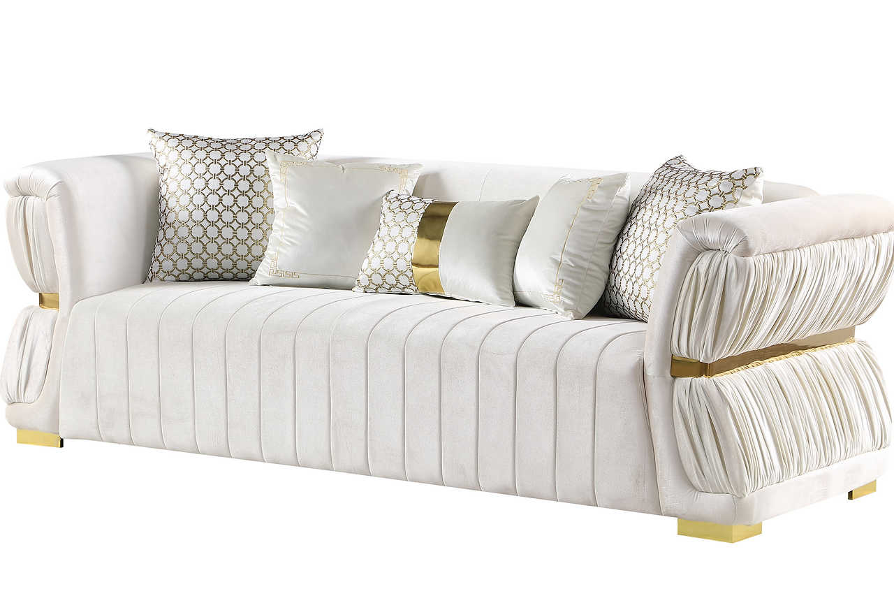 Close-up detail of white velvet upholstery and gold accents on Anna White living room set