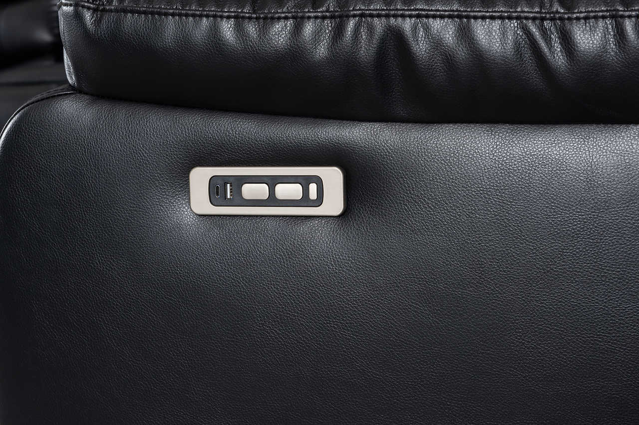 Black sectional sofa showing power recliner control