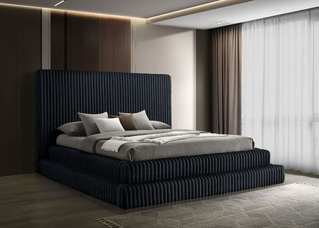 Micah black upholstered platform king bed angled view showing headboard and platform