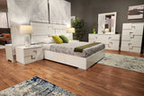 Close-up of the butter-colored faux suede upholstered headboard