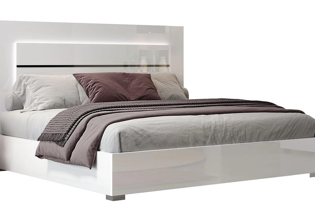 Side profile of white solid wood nightstand with marble top