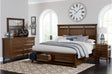 Main view of brown cherry upholstered storage platform bed in bedroom set