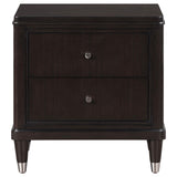 Close-up of Emberlyn nightstand showing tapered feet with metallic caps