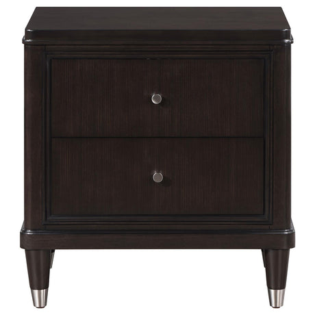 Close-up of Emberlyn nightstand showing tapered feet with metallic caps
