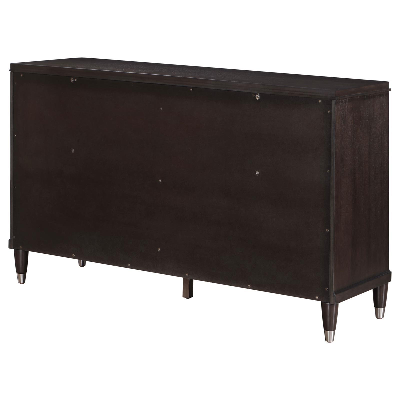 Dresser top decorated with framed photos