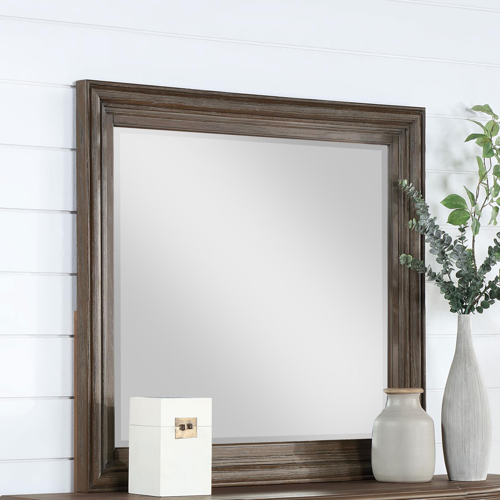 Close-up of Emmett mirror beveled glass and walnut frame