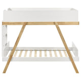 Close-up of upper bunk with solid panel guardrails