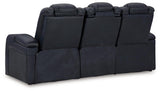 Flip-top storage armrest with cup holders and charging ports