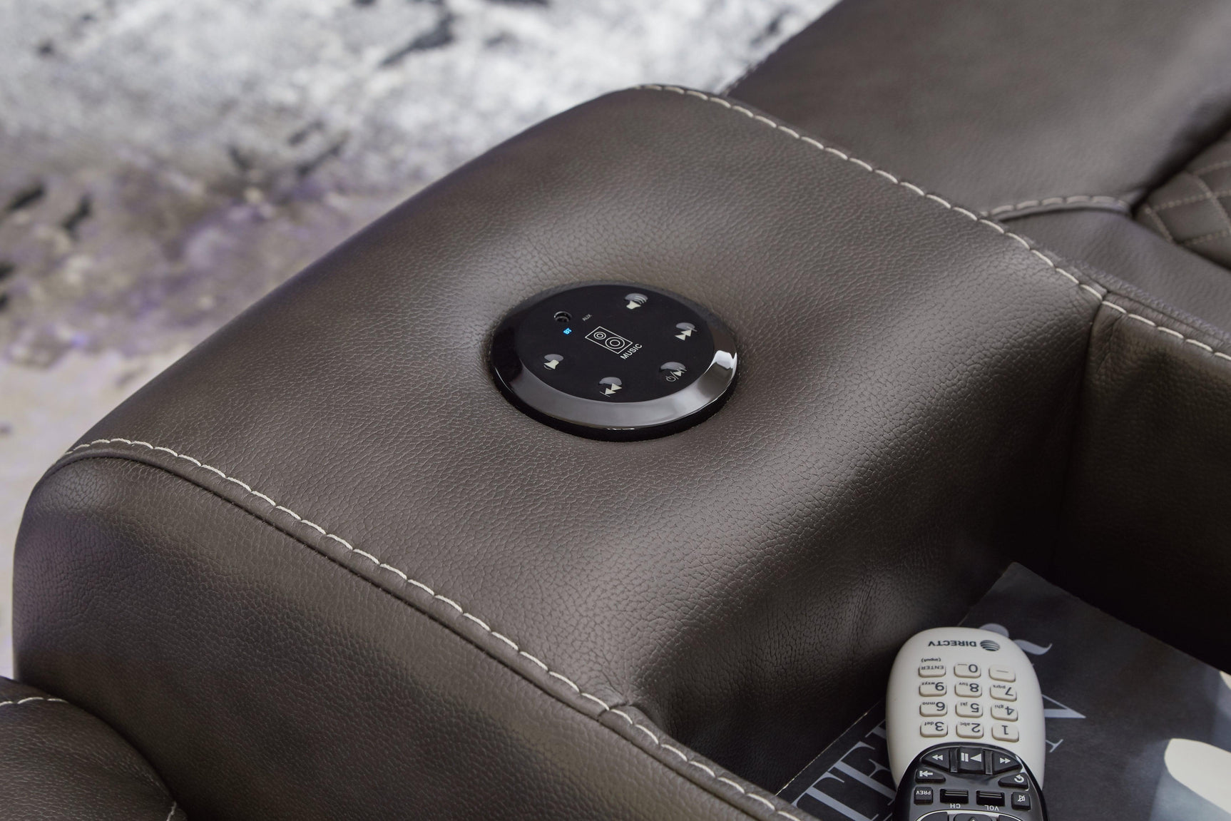 Wireless audio system controls on loveseat console