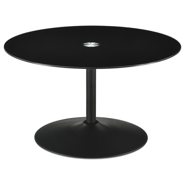 Ganso round metal coffee table with dark tempered glass top angled view