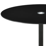 Close-up of black tempered glass top on Ganso table