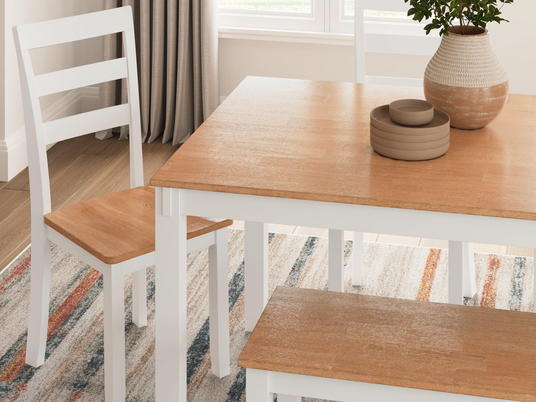 Close-up of table's butcher block veneer top and white apron