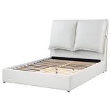 Bed with pillows attached on headboard