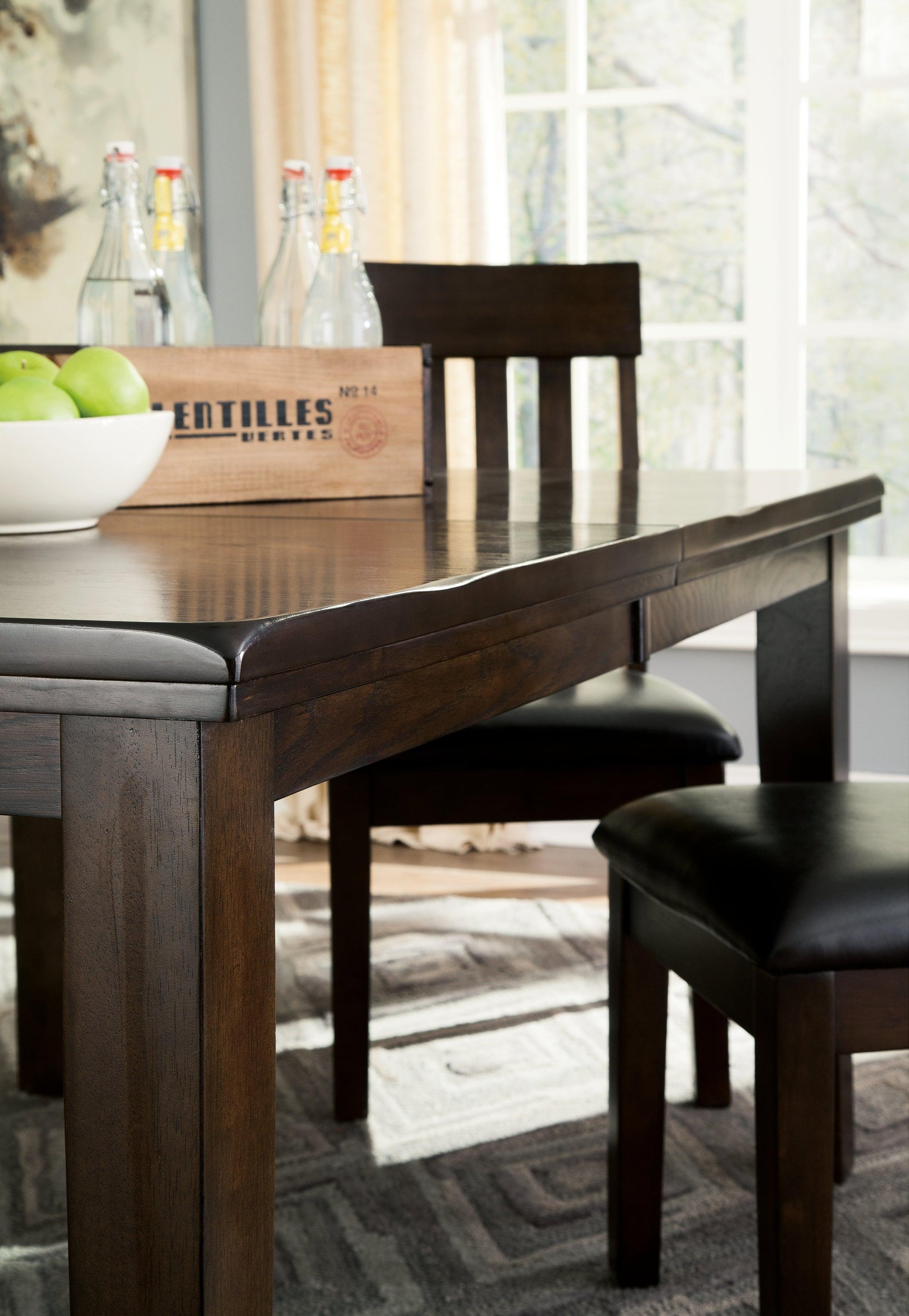 Detail of Haddigan Dark Brown Dining Room Set wood finish and upholstery