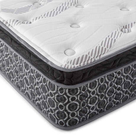 Side angle of Hayes 11 inch Twin XL pillow top memory foam hybrid mattress